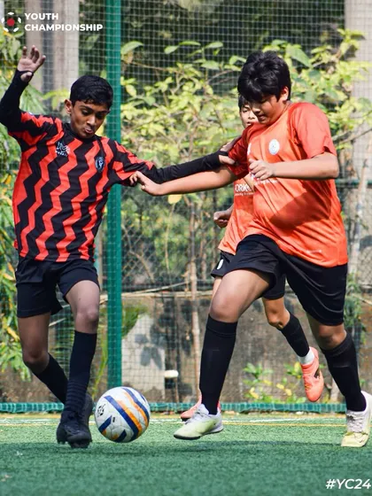 A player shielding the ball under pressure. Every play counts, and ball retention is a critical part of our training.