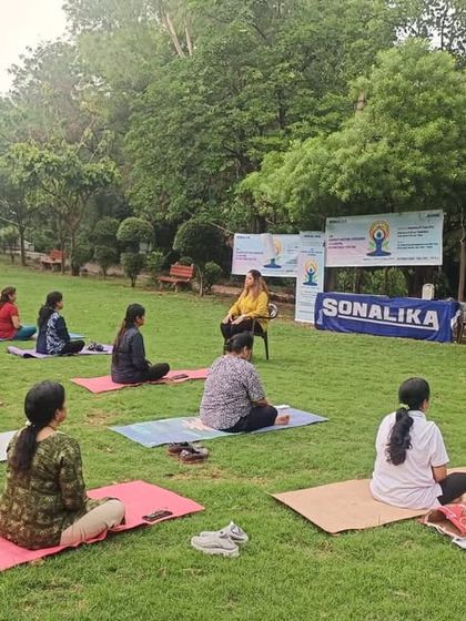 A smaller group session held outdoors, sponsored by a local partner. We collaborate with organizations to bring the benefits of yoga to a wider audience.