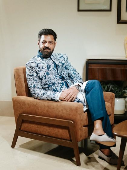 A stylish portrait of the groom. We coordinate with photographers to capture not just the event, but the personalities of our clients.