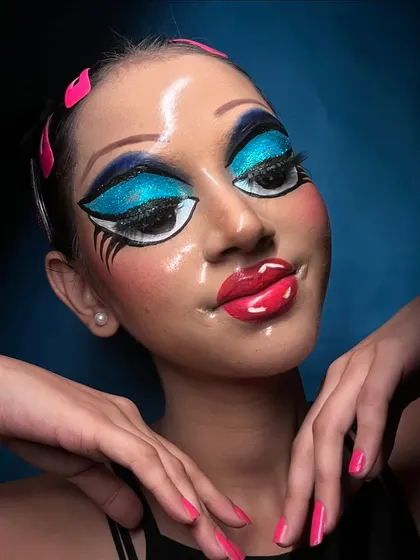 A playful pose that captures the fun and creativity of this Pop Art makeup style.