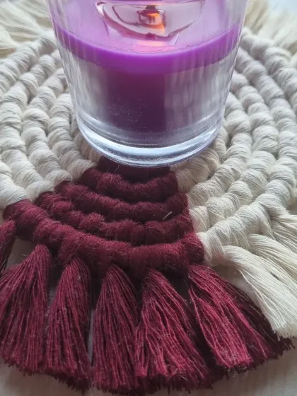 My spiral coasters can also double as a beautiful base for a candle, creating a cozy and decorative accent. This one is in a rich maroon and white.