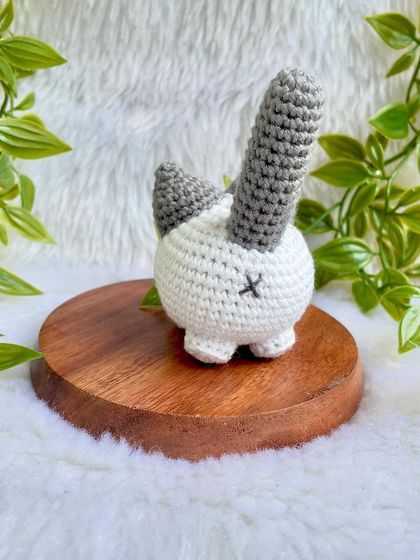 A grumpy but cute little cat plushie. I love his expressive face! This was a custom order to replicate a customer's pet, and I'm so happy with how he turned out.