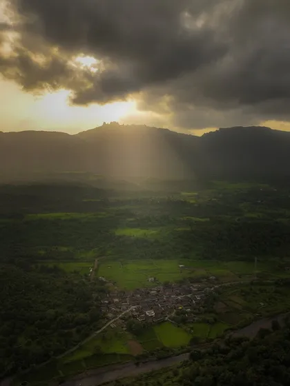 The sun's rays break through the clouds over the village of Chinchavali. These divine light beams are a magical moment that only lasts for a few seconds, and I was lucky to capture it.