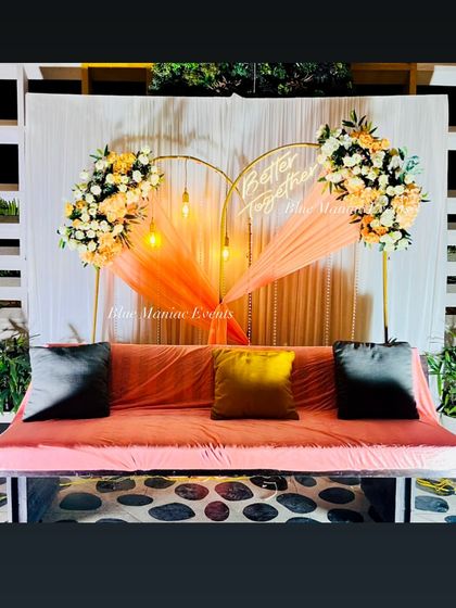 The full view of the heart-shaped arch and swing setup, perfect for a picturesque engagement ceremony.