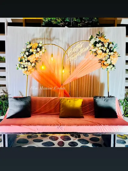 The full view of the heart-shaped arch and swing setup, perfect for a picturesque engagement ceremony.
