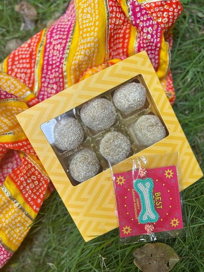 Our Rakhi hamper, beautifully displayed. It combines the tradition of a Rakhi with the joy of a sweet treat, making it the perfect gift for your dog.