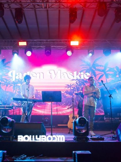 On stage in Goa with my keyboardist. Our live setup is professional and versatile, ensuring high quality sound for any event.