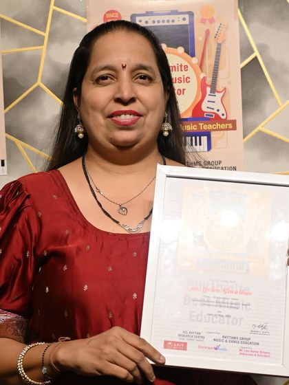 Ms. Netra Biwalkar, another recipient of the Rhythmite Best Music Educator Award, celebrated for her dedication to music teaching.