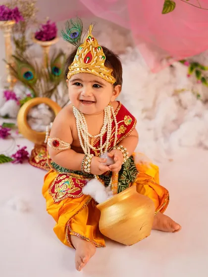 Our little 'Makhan Chor' caught in the act with a pot of butter. We love creating playful scenarios that bring out the charm and mischief of the Krishna theme.