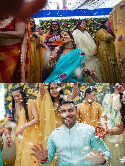 The bride and groom are showered with flower petals by their loved ones, creating a beautiful and joyous scene at their Haldi ceremony.