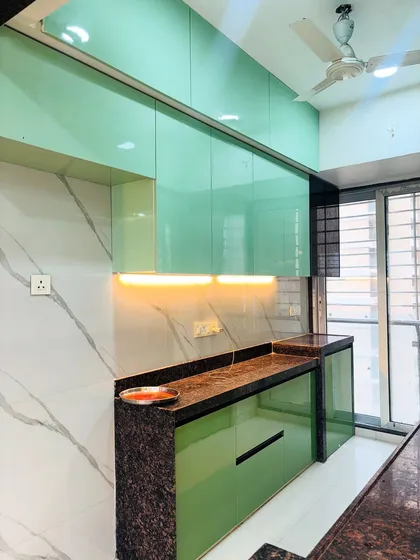 The under-cabinet LED lighting not only illuminates the workspace but also highlights the beautiful texture of the marble-style backsplash.
