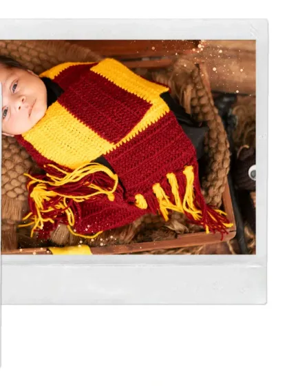 "The chosen one." A newborn dressed as Harry Potter, complete with a Gryffindor scarf. This is a perfect theme for parents who are fans of the wizarding world.