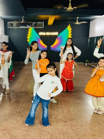 Our students posing with patriotic spirit. We encourage them to express their pride and joy through dance and performance on special occasions like Independence Day.