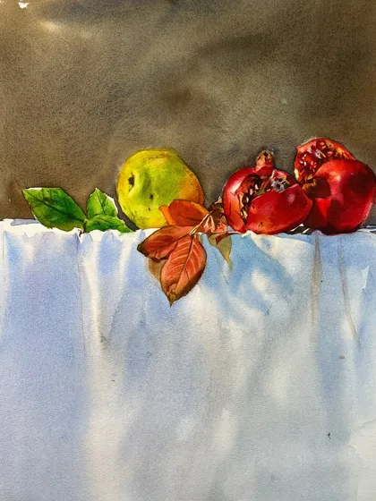 The finished still life with pomegranates and a pear, showing the rich reds and the soft texture of the white cloth.