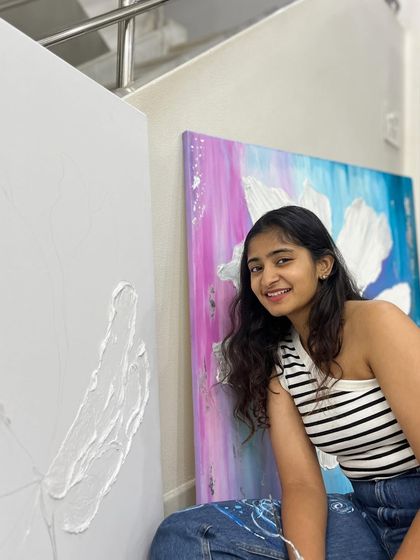 A happy moment while working on the second canvas of my textured flower series. You can see the first painting in the background, serving as a guide and inspiration for the new piece.