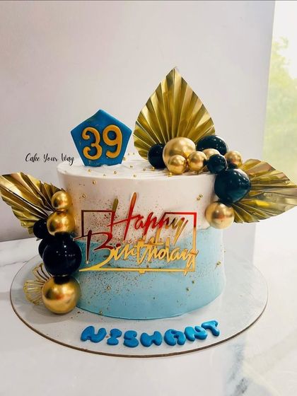 Age is just a number, but this cake is pure perfection. A stylish blue, black, and gold cake for a 39th birthday.