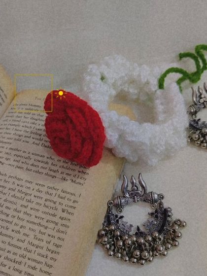 My 'Manjari' crochet gajra, a modern take on the traditional hair accessory. This one features a beautiful red rose on a bed of white mogra-style crochet flowers.