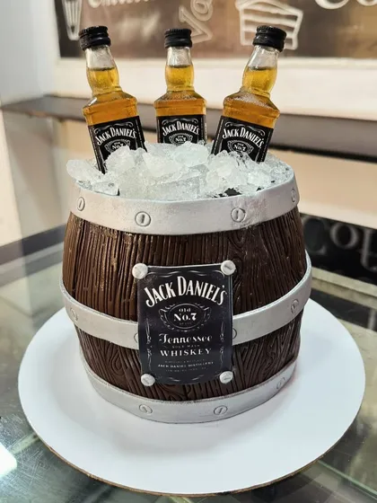 For the whiskey connoisseur, we crafted this realistic Jack Daniel's barrel cake. The wood grain texture and edible ice are all meticulously detailed to create a show-stopping centerpiece for an adult celebration.