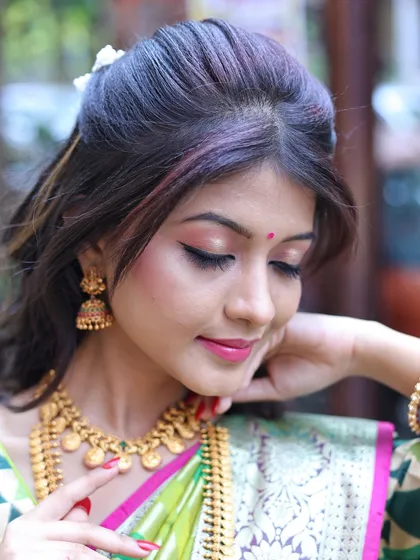 Another angle of the soft glam makeup, highlighting the subtle contouring and glowing skin finish.