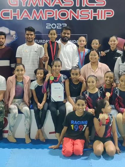 More moments of triumph from various competitions, showcasing our gymnasts with their medals, trophies, and proud coaches.