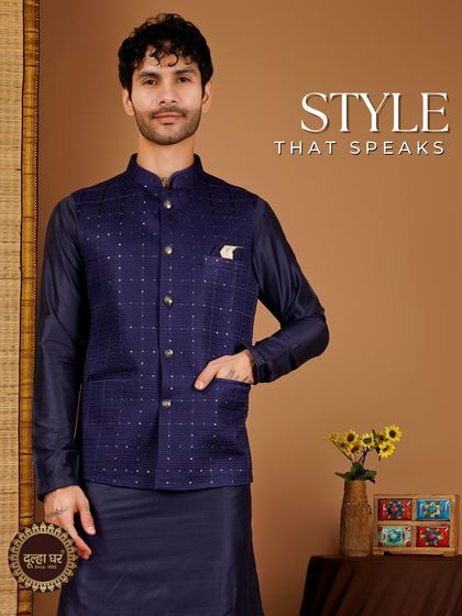 Style that speaks. A navy blue Nehru jacket with subtle embroidery, paired with a matching kurta for a deep, monochromatic look.