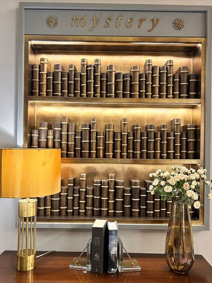 A beautiful bookshelf with the word "mystery" on top. This is a reminder to embrace the unknown and become comfortable with uncertainty. Life is never linear, and you will only grow wiser.