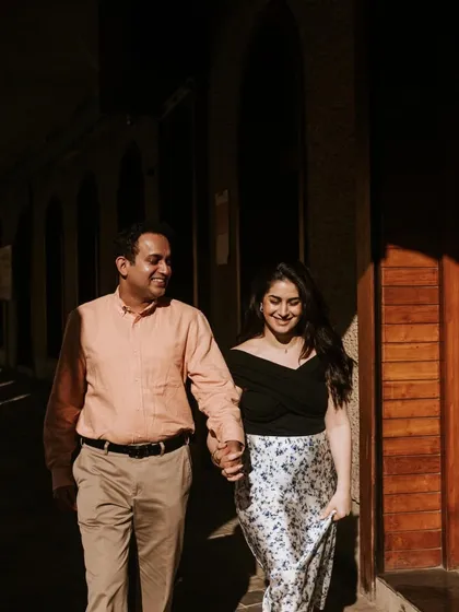 A candid walking shot, capturing a natural interaction between the couple. These unposed moments are often the most cherished from a pre-wedding shoot.