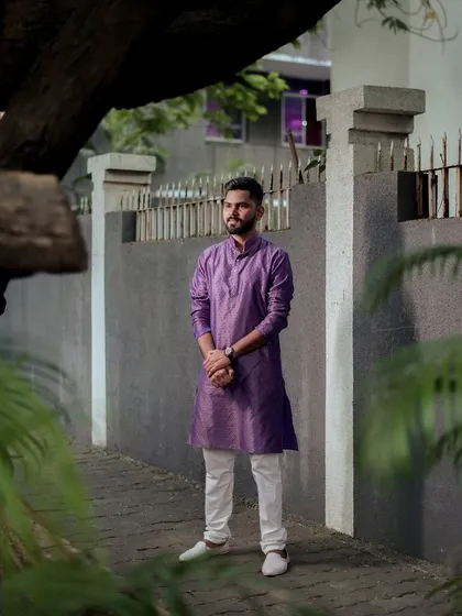 A stylish portrait of the groom standing in an urban laneway, creating a modern yet traditional look.