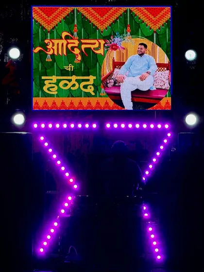 Even for smaller parties, I deliver a big impact. This is my compact DJ setup, customized for a Haldi ceremony with personalized graphics on the LED screen, proving you don't need a huge space to have a professional-looking event.