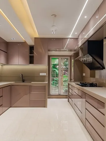 We love bringing the latest trends to your home. This kitchen in Malad features a beautiful Rose Gold slim profile on full back-painted glass panels. It’s a luxurious and modern look, built with the reliability of Häfele and Blum hardware to ensure it stays perfect for years.