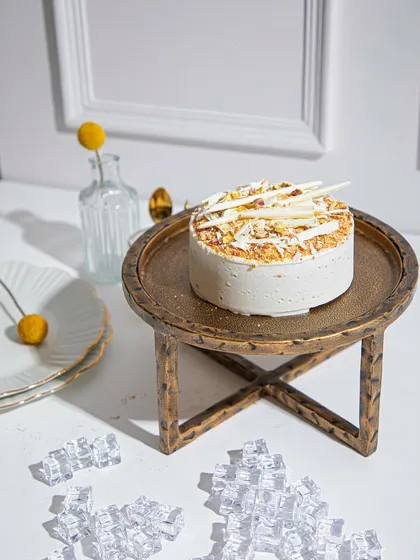 Another view of the Vanilla Raspberry ice cream cake, highlighting its delicate toppings and sophisticated presentation.