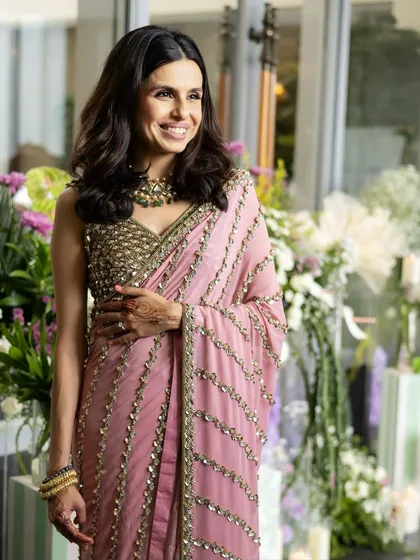 A candid, happy moment. The makeup is designed to look beautiful and natural in any light, capturing the joy of the celebration perfectly.
