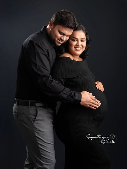 The dark, minimalist background makes the couple's happy expressions and their embrace the center of the story.