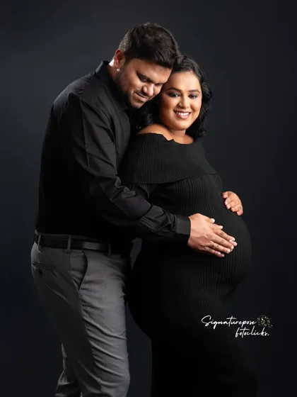 The dark, minimalist background makes the couple's happy expressions and their embrace the center of the story.