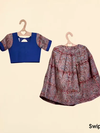 This set pairs a royal blue choli with a detailed Kalamkari print skirt. The choli has printed sleeves that match the skirt, creating a cohesive and stylish look for any festive occasion.