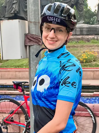 A close-up portrait of a smiling rider.