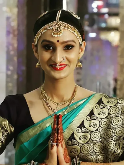 I also create authentic looks for my beautiful South Indian brides. This look features sharp, defined eyes, a classic red lip, and traditional hair and jewelry styling to honor cultural traditions.