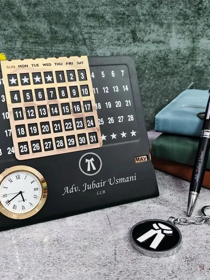 This is a custom desk set I made for an Advocate. The infinite calendar, pen, and keychain are all personalized with the lawyer's name and the advocate symbol, creating a thoughtful and practical gift for legal professionals.