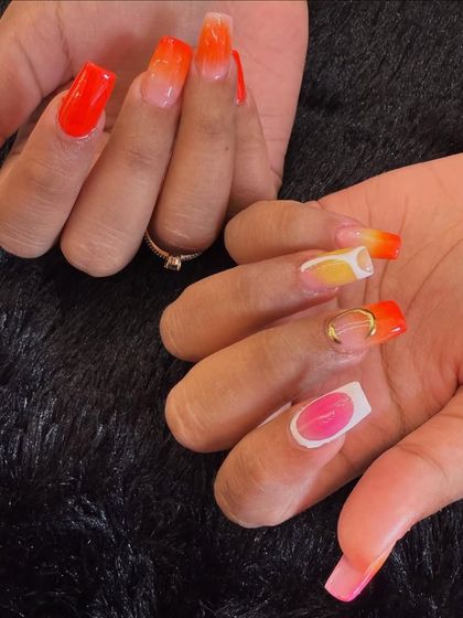 The ultimate vacation nails. This long, squared-off set features a vibrant, multi-colored ombre that is perfect for a tropical getaway.