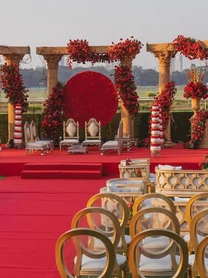 For the love of tradition, a 'Jashn e Ishq' theme brought to life. This design uses bold reds, majestic pillars, and a striking floral moon gate to create a regal and passionate setting for your wedding ceremony.