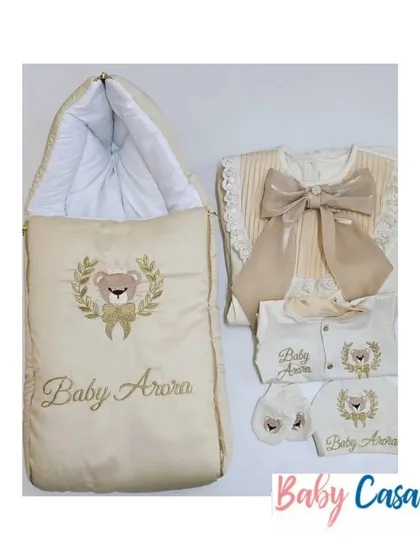 A beautiful neutral toned set for "Baby Arora." This collection features a sleeping bag and multiple romper options, all personalized and themed with a teddy bear crest.