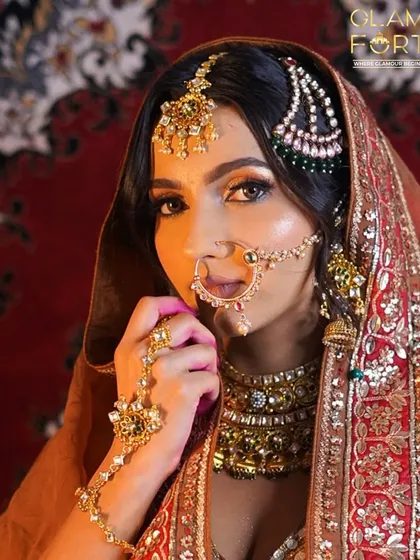 A powerful and direct look from our Heeramandi-inspired bride. The contouring is sharp, and the lips are defined to create a look of regal confidence.