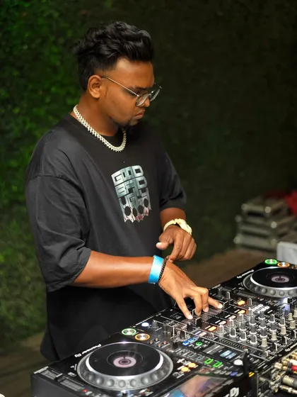 A close-up shot while I'm cueing up the next track. I'm constantly reading the crowd and adjusting my set, mixing in everything from R&B to commercial hits to keep the vibe just right.