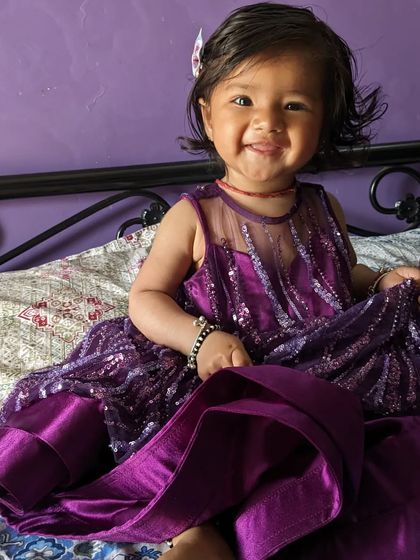 Even the little ones can join the twinning fun. This is the baby's dress from our purple sequin mother-daughter combo, designed to be comfortable and cute.