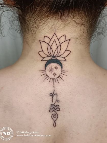 A delicate and spiritual design for the back of the neck, featuring a lotus, crescent moon, and the Unalome symbol. This tattoo represents the journey to enlightenment through life's challenges.