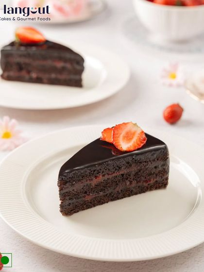 A slice of pure bliss. This pastry features layers of rich chocolate cake and sweet strawberry filling, all covered in a glossy chocolate glaze. A classic combination loved by all.