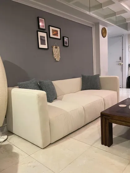 Another view of the minimalist sofa, showing its clean lines.