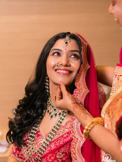 A bride's happy anticipation as she gets her final touches. We capture the excitement of the getting-ready process.