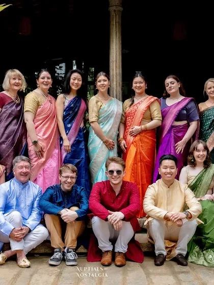 Guests from around the world dressed in vibrant sarees and kurtas, celebrating a beautiful fusion wedding at our venue.