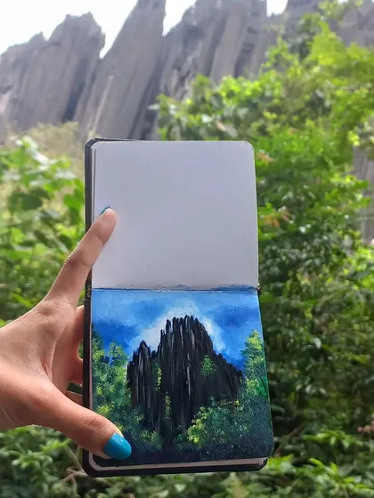 Here is my finished acrylic painting of the Yana rock formations, held up against the actual landscape that inspired it. For me, art is about connecting with a place, and this piece, created from a live sketch, is a direct memory of my journey through Uttara Kannada.